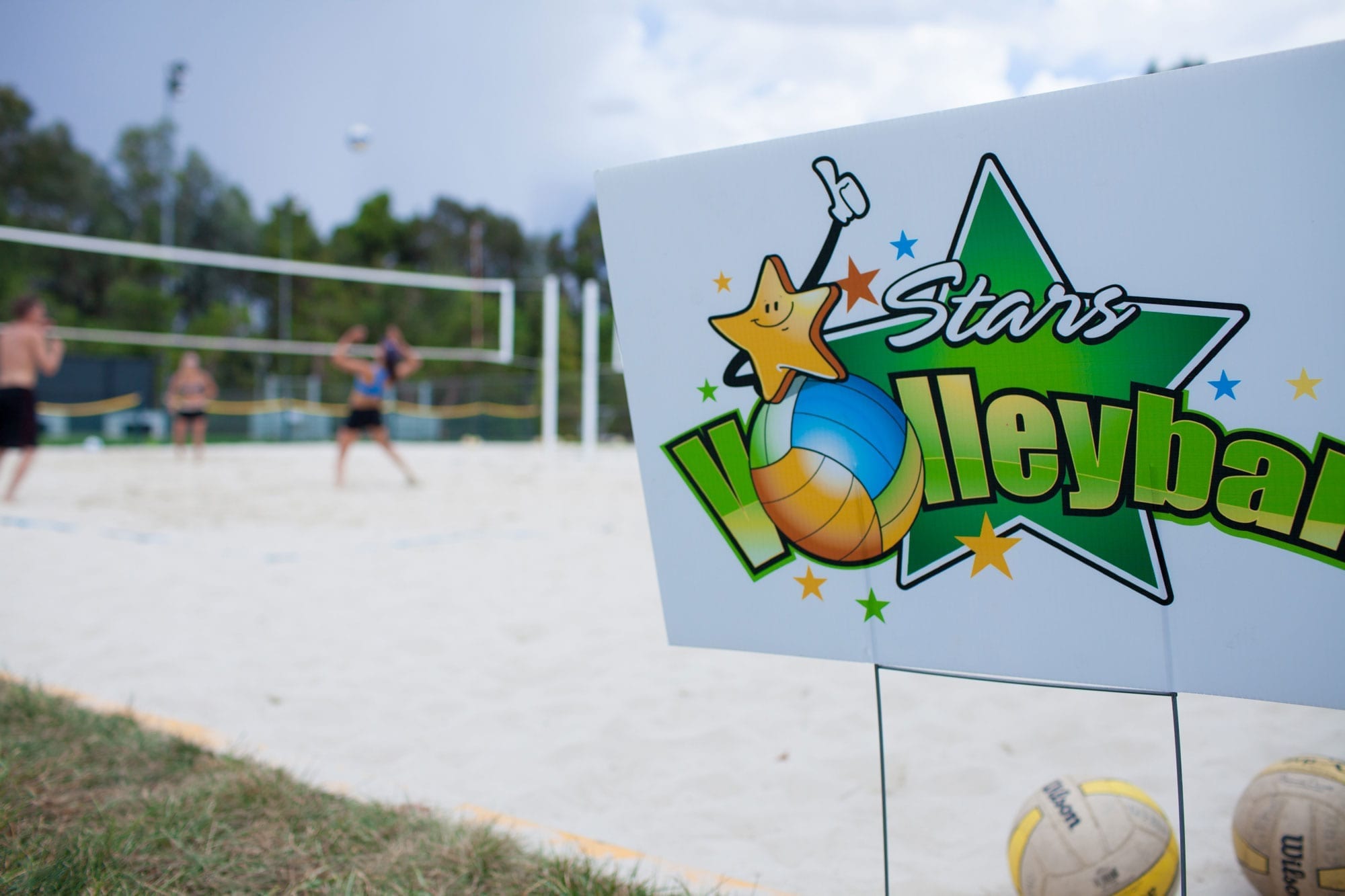 Stars Volleyball sign at a sand court